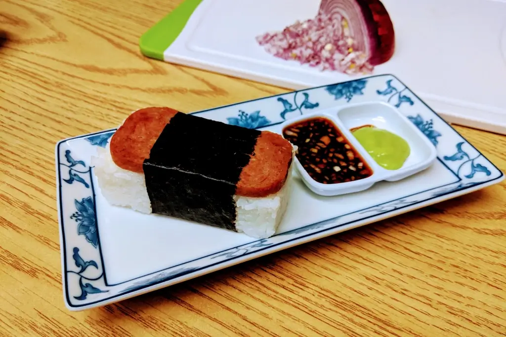 A plate of spam musubi. (A rice cake with Spam on top).