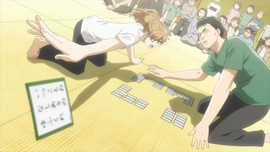 The characters from "Chihayafuru" playing an intense game of karuta.