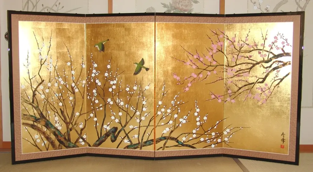 A Japanese screen painting featuring flowers on trees.