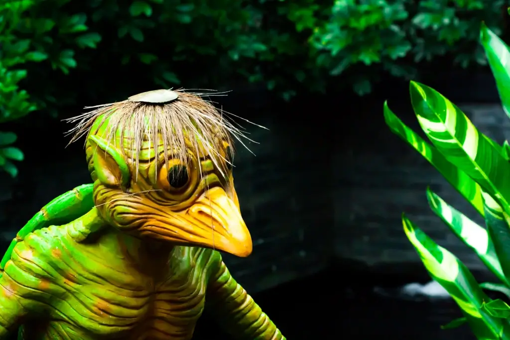 A kappa statue. It resembles a shell-less turtle with a yellow beak.