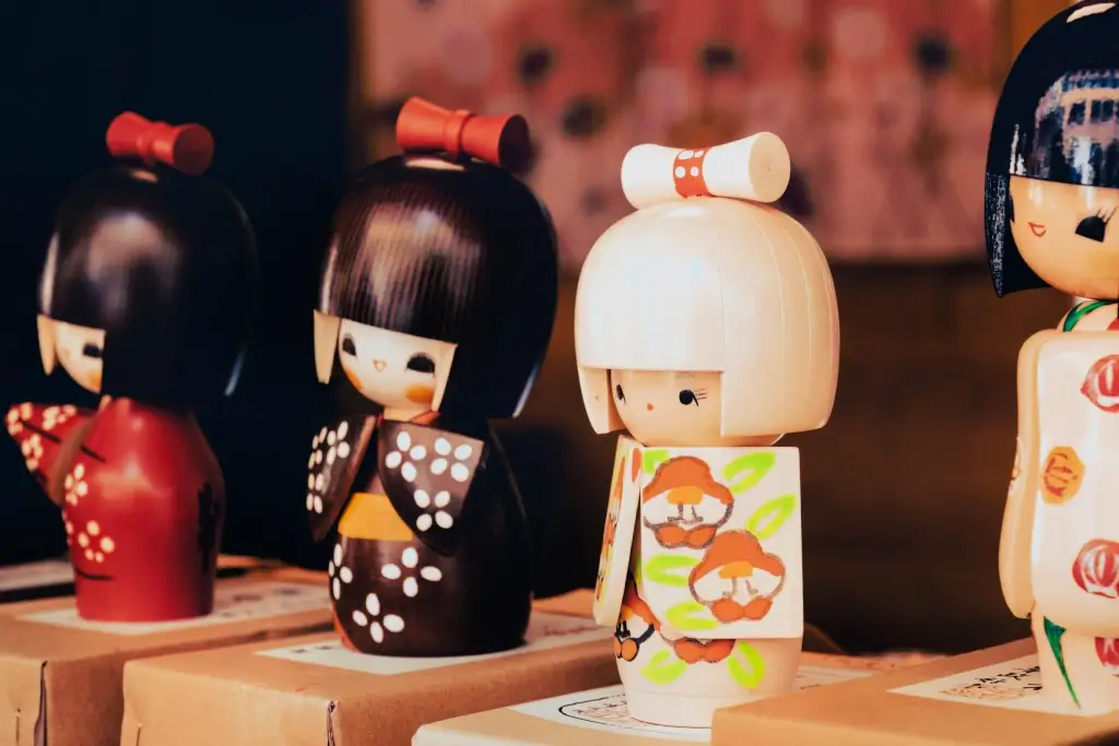 Four Japanese wooden dolls.