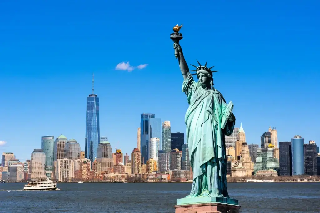 The New York City skyline, with the Statue of Liberty in the background.