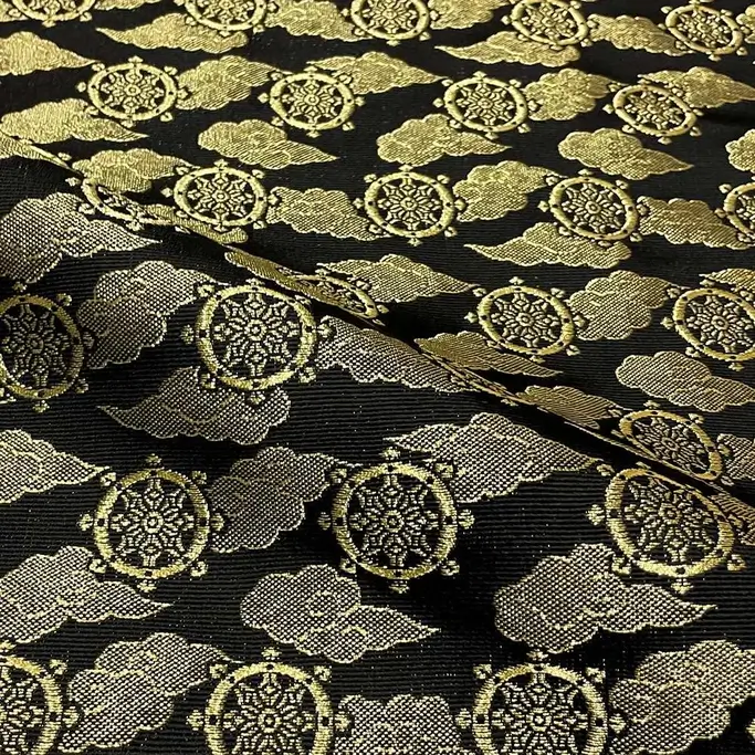 A sheet of black and gold nishijin brocade.