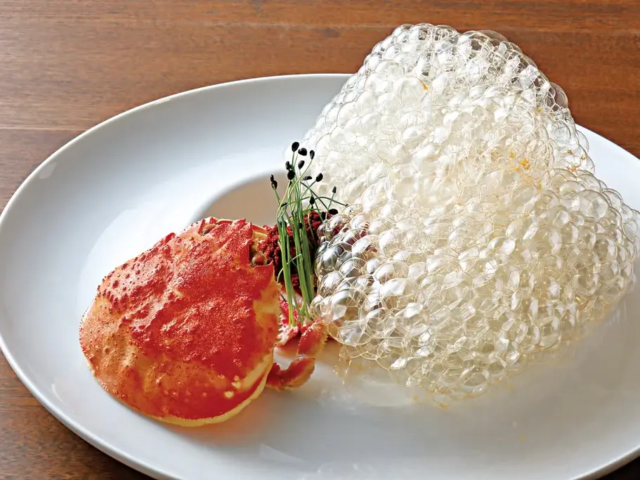 A plate of crab with foam on the side from Shokudo Yarn.