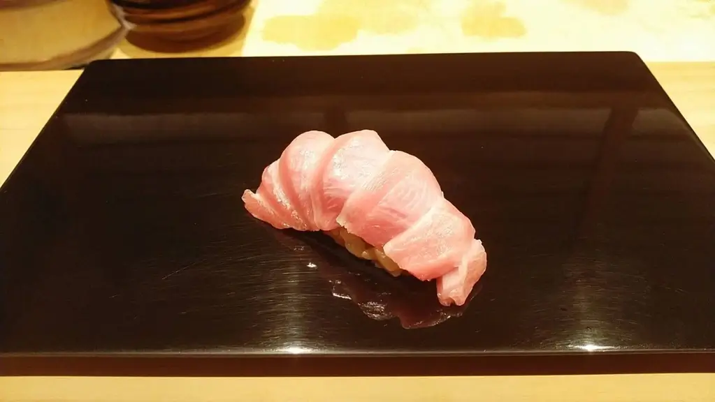 A piece of ootoro sushi from Sushi Ryusuke.