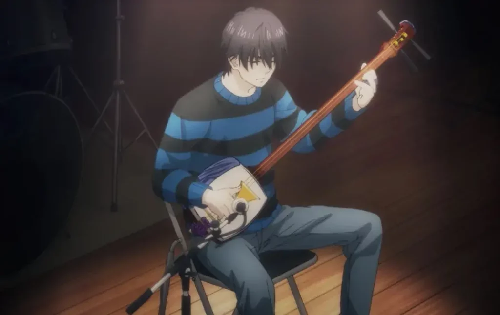 The main character of "Those Snow White Notes" playing the shamisen.