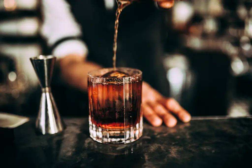 Someone pouring a glass of Japanese whiskey.