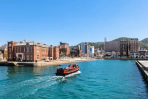 A boat sailing through Mojiku Port in Kitakyushu.