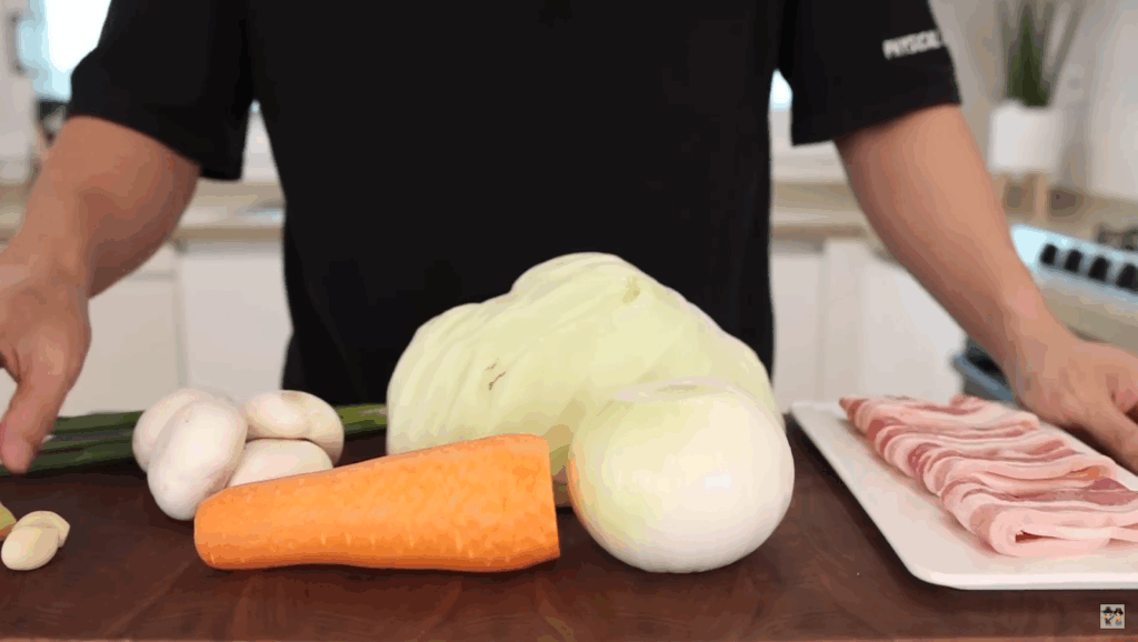Aaron preparing ingredients for their Yakisoba recipe in a home kitchen