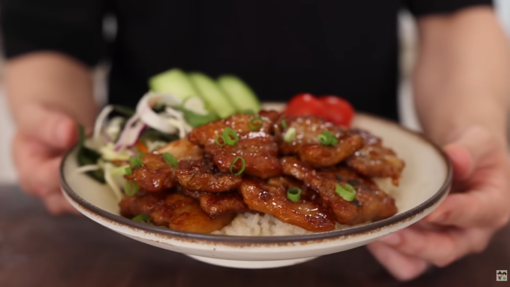 A bowl of Soy-Glazed Pork Belly Rice Bowl by Aaron and Claire