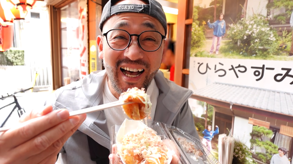 Satoshi enjoying Takoyaki near Asagaya Station
